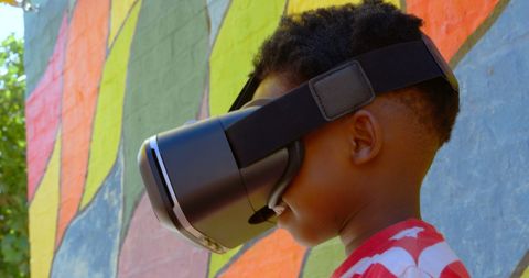 Boy Using Virtual Reality Headset in Colorful Playground - Download Free Stock Images Pikwizard.com