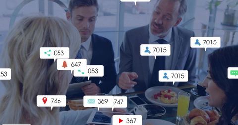 Business Professionals Engaging with Technology for Networking and Planning