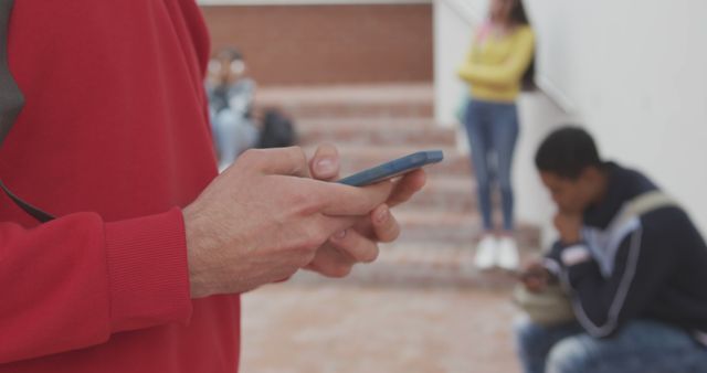 Person Using Smartphone Outdoors in Urban Area - Download Free Stock Images Pikwizard.com