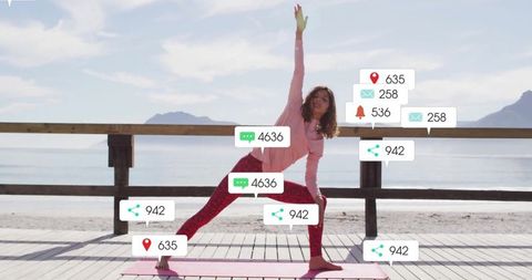Woman Practicing Yoga with Notifications by Scenic Seaside