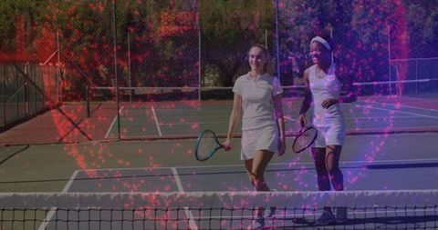 Female Tennis Players Chatting Sharing Joy on Outdoor Court