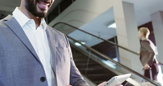 Confident Businessman Using Tablet in Modern Office Building - Download Free Stock Images Pikwizard.com