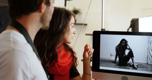 Photographer and Model Reviewing Photos on Computer - Download Free Stock Images Pikwizard.com