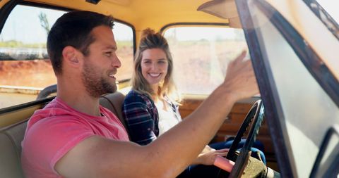 Smiling Couple Driving Vintage Car in Sunny Landscape - Download Free Stock Images Pikwizard.com