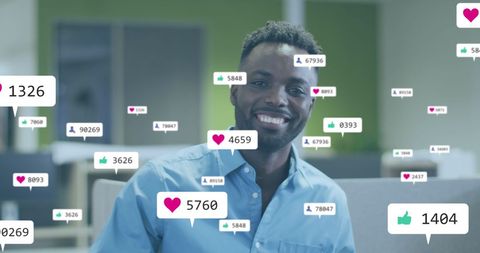 Smiling Businessman Engaged with Social Media Icons