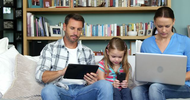 Family Using Different Digital Devices on Couch - Download Free Stock Images Pikwizard.com