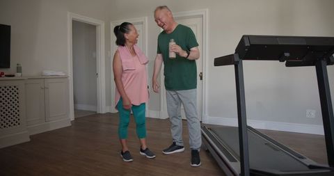 Senior Couple Enjoying Post-Exercise Moment at Home