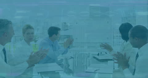 Business Team Applauding Amid Overlapping Financial Data Projections