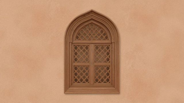 Vintage arched wooden lattice window on tan plaster wall