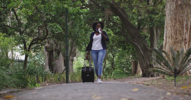 Confident Woman Walking Down Path with Suitcase - Download Free Stock Images Pikwizard.com