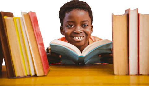 Joyful Boy Engaged in Reading Book Between Library Shelves, Transparent Background - Download Free Stock Videos Pikwizard.com