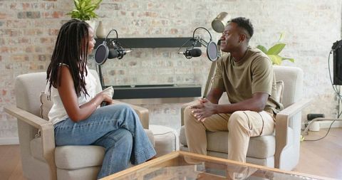 African Colleagues Recording Podcast in Cozy Home Studio Conversing During Interview