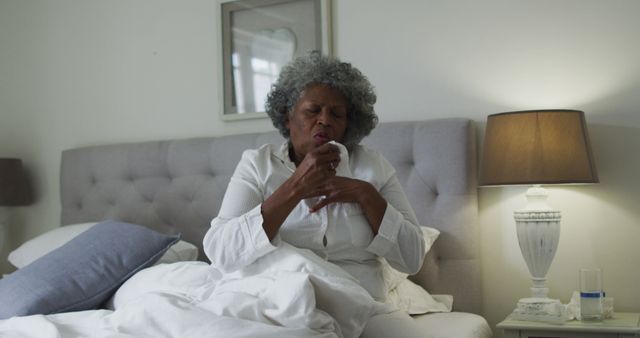 Senior African American Woman Coughing in Bed in Her Bedroom - Download Free Stock Images Pikwizard.com