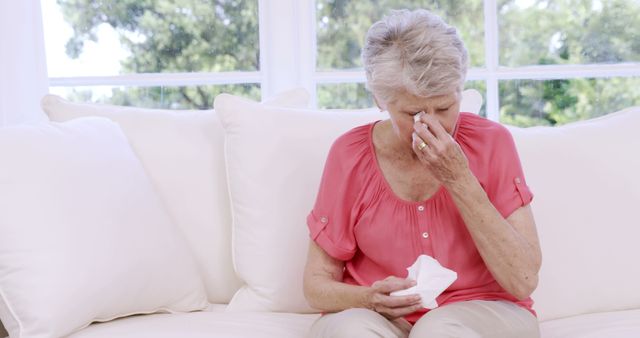 Senior woman crying on the sofa in slow motion - Download Free Stock Photos Pikwizard.com
