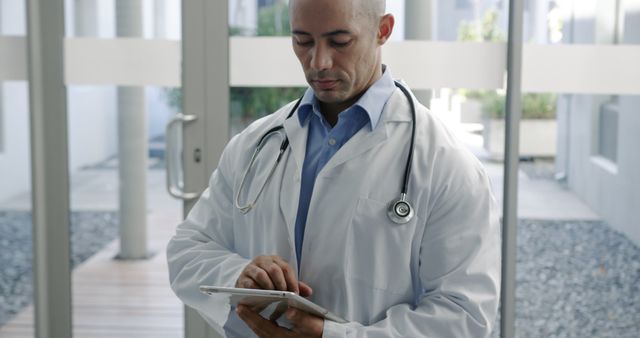 Doctor Using Digital Tablet with Stethoscope in Modern Clinic - Download Free Stock Images Pikwizard.com