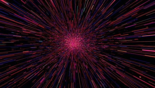 Dynamic Explosion of Colored Light Streaks on Black Background