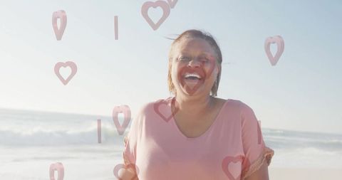 Joyful Senior Woman Enjoying Beach Bliss Under Sunny Skies