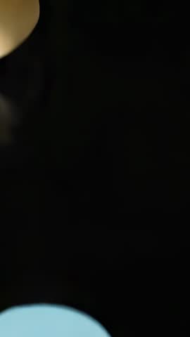 Hand Pushing Pastel Circles Rolling Off Black Surface | Vertical Craft Animation Loop