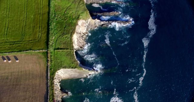 Aerial View of Coastal Cliff and Ocean Waves Hitting Rocky Shoreline - Download Free Stock Images Pikwizard.com