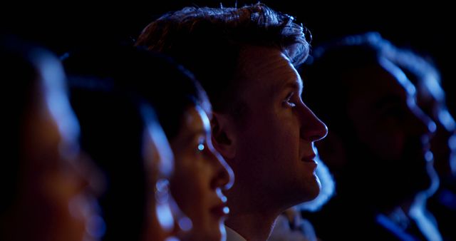 Focused Businessman Listening During Seminar in Dark Auditorium - Download Free Stock Images Pikwizard.com