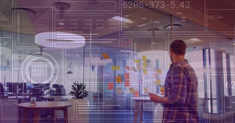 Businessman Analyzing Financial Data on Digital Interface at Modern Office