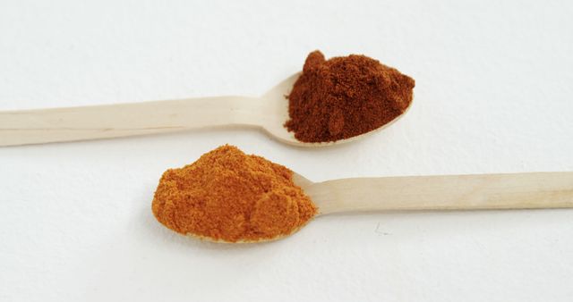 Two Wooden Spoons with Different Colorful Spices on White Background - Download Free Stock Images Pikwizard.com