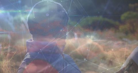 Digital Connections Overlaying Man Using Tablet Outdoors