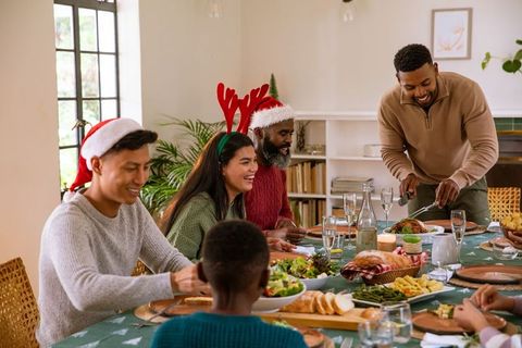 Diverse Family Celebrating Festive Holiday Turkey Dinner at Home