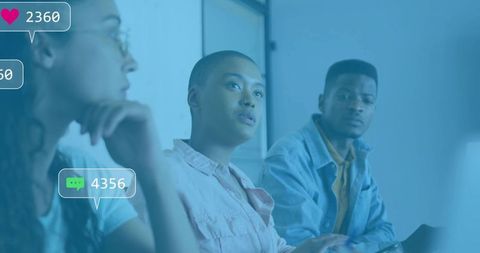 Diverse Team Analyzing Digital Metrics in Modern Meeting