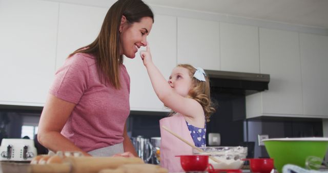 Mom and Daughter Having Fun Baking in Kitchen - Download Free Stock Images Pikwizard.com