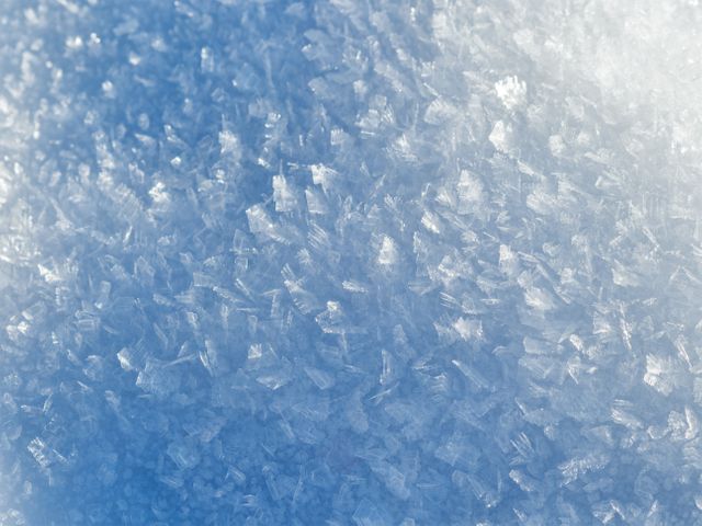 Perfect for use in winter-themed designs, backgrounds for holiday cards, illustrations related to cold or icy conditions, and promoting winter sports. This serene display of nature's beauty can also be used in education to illustrate the science of snow and ice formation.
