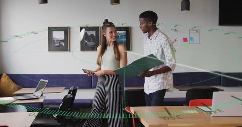 Diverse Colleagues Collaborating with Innovative Technology in Modern Office