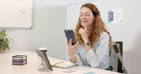 Professional Woman Working with Smartphone in Modern Office