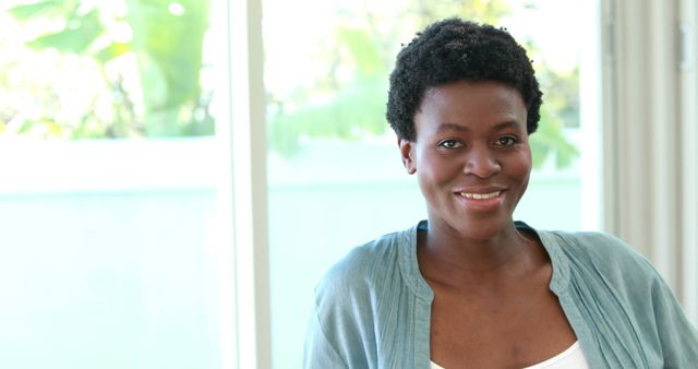 Smiling African American Woman in Casual Wear at Home - Download Free Stock Images Pikwizard.com