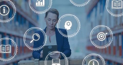 Mature woman using tablet in warehouse surrounded by logistics and inventory icons