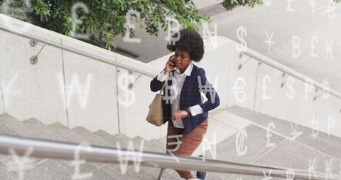 Businesswoman Talking on Phone with Overlay of Currency Symbols