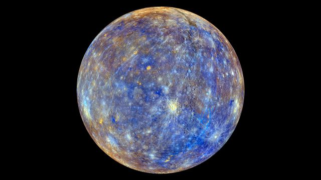This enhanced color image of Mercury highlights the planet's diverse chemical, mineralogical, and physical properties. The light blue and white rays extend from young impact craters, while darker blues indicate low-reflectance material on the crust. Tan areas result from volcanic activity. Perfect for educational materials, astronomy presentations, and scientific publications focusing on planetary geology and space exploration.