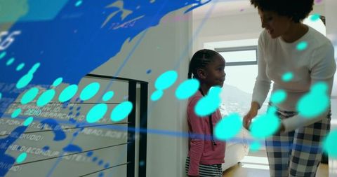 Parent helping child adjusting sleeve near window, digital overlay, modern sunlit interior