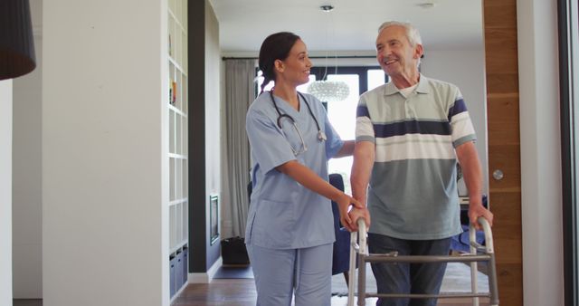 Healthcare professional assisting senior male with walker indoors - Download Free Stock Images Pikwizard.com