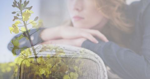 Double exposure woman in thought with flowers