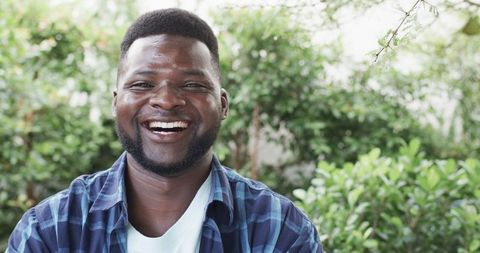 Smiling African American Man in Outdoor Garden - Download Free Stock Images Pikwizard.com