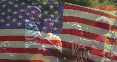 Family audaciously celebrating summer with playful joy under u.s. Flag