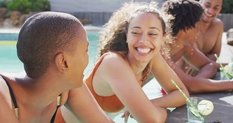 Friends Enjoying Poolside Laughter with Refreshing Drinks - Download Free Stock Images Pikwizard.com