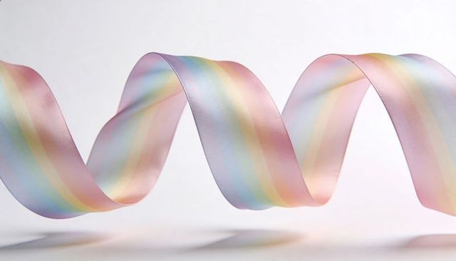Pastel rainbow satin ribbon curling helix with soft shadows and stitched silk edges