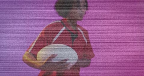 Confident Female Rugby Player Holding Ball Against Magenta Backdrop