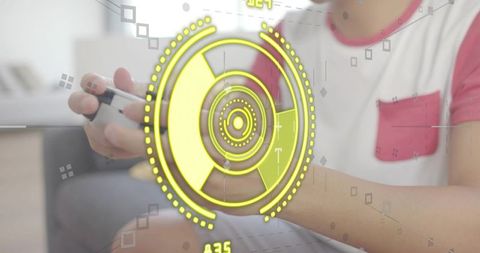 Asian male playing console games on couch holding white controller with neon hud overlay