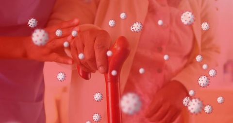 Healthcare Professional Assisting Senior Amid COVID-19 Virus Visualization