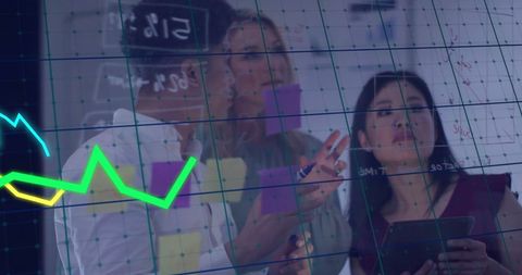 Diverse business team analyzing economic data with financial graph overlay