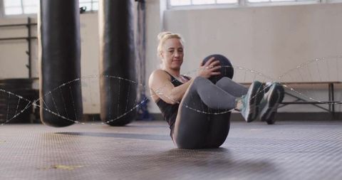 Fitness Enthusiast Performing Russian Twist in Industrial Gym Setting