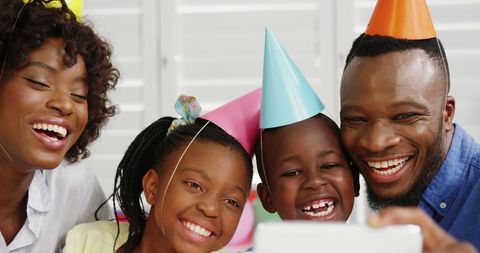 Happy Family Celebrating and Taking Selfie at Birthday Party
